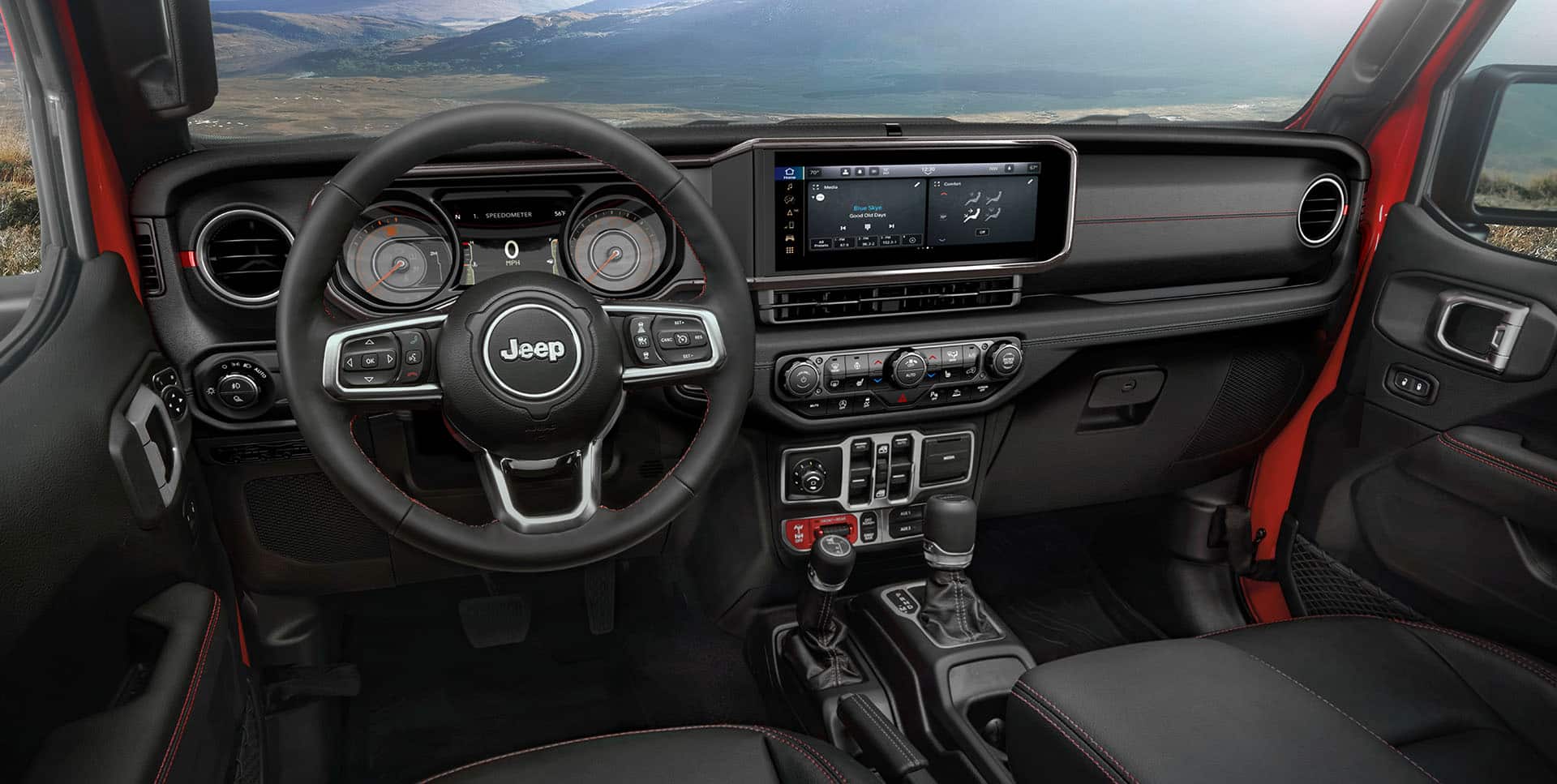 The steering wheel, Driver Information Digital Cluster, Uconnect touchscreen, center stack controls and dash in the 2024 Jeep Gladiator Rubicon.